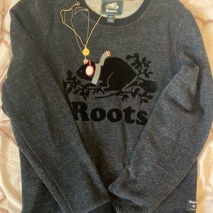 black roots sweater